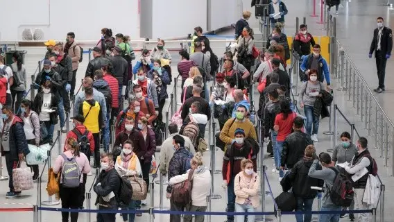 Romanian seasonal workers wait for check-in at the Avram Iancu International Airport in central Romania