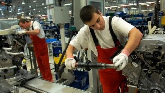 Workers on an assembly line at an Audi factory in Hungary