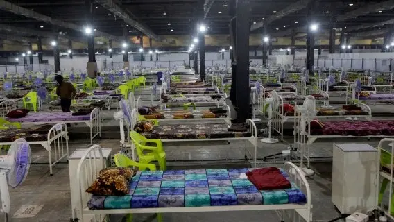 Newly arranged beds lie inside a Covid-19 treatment centre set up for emergencies in the wake of spike in the numbers of positive coronavirus cases in Mumbai, India