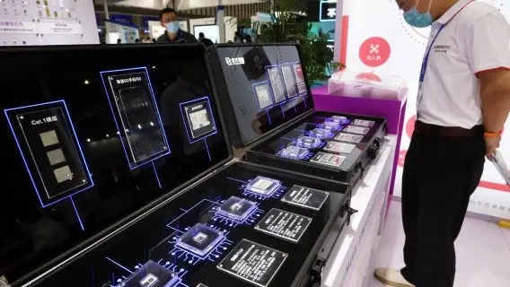 People watch the semiconductor products exhibited at the 2020 World Semiconductor Conference in Nanjing city, east China's Jiangsu province