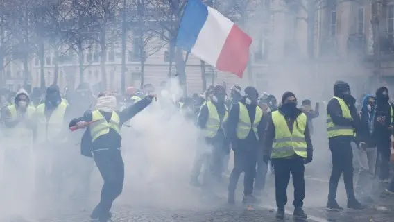 Paris, France. Demonstrators during a protest against rising cost of fuel and oil prices by people wearing yellow vests.
