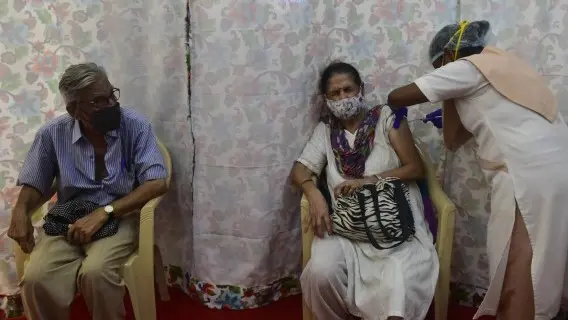 A woman gets a Covid-19 vaccination in one of the worst-hit Indian states of Maharashtra