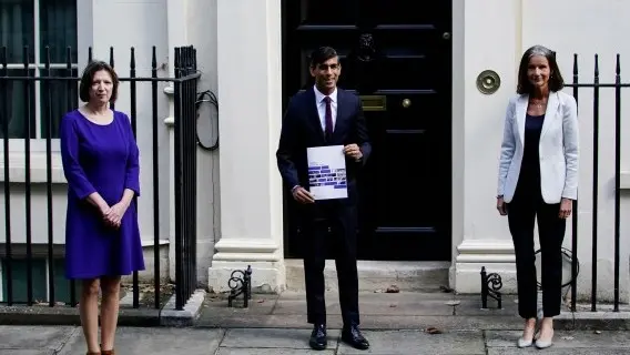 Britain's Chancellor of the Exchequer Rishi Sunak (C) and Dame Carolyn Julie Fairbairn, Director General of the CBI (R) and Frances O'Grady, General Secretary of the TUC, (L) stand outside 11 Downing Street, London