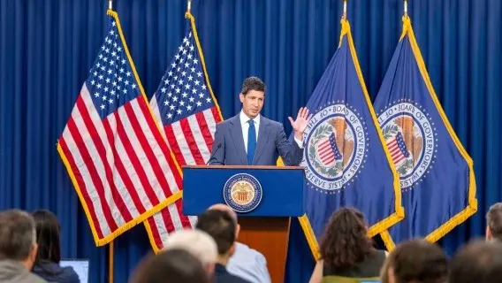 Fed Chair Warsh announcing that rates remain on hold despite three dissenting votes
