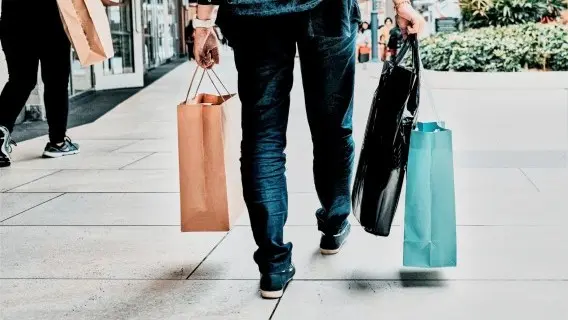 Man_in_casual_clothes_walks_with_shopping_bags._(1)_.jpg