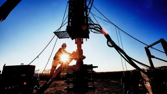 Workers_setting_up_a_well_in_an_oil_nd_gas_drilling_operation.jpg
