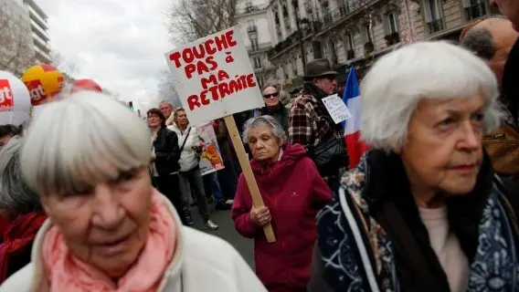 'Don't touch my pension' reads the placard at a pensioners' protest in Paris, 2018