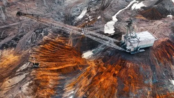 An excavator works in a quarry for the extraction of rare earth elements