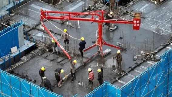 Real estate continues to be a drag on China's economy. Pictured: a residential construction site in Huaian, eastern China