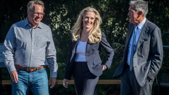 Fed Chair Jerome Powell, right, takes a break with fellow bankers, Lael Brainard and John Williams in Jackson Hole