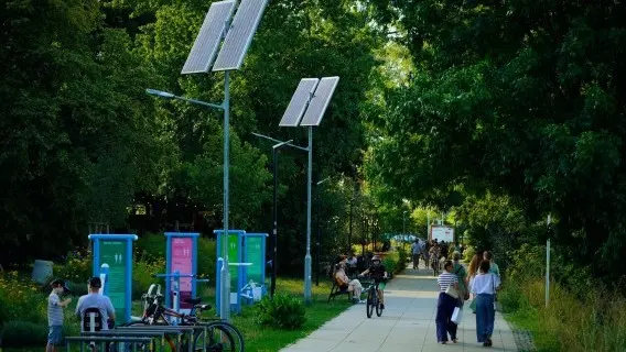 Solar panels lining a pedestrian path along the Vistula river in Warsaw, Poland