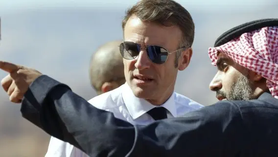 French President Emmanuel Macron was in Saudi Arabia as political chaos unfolded back home