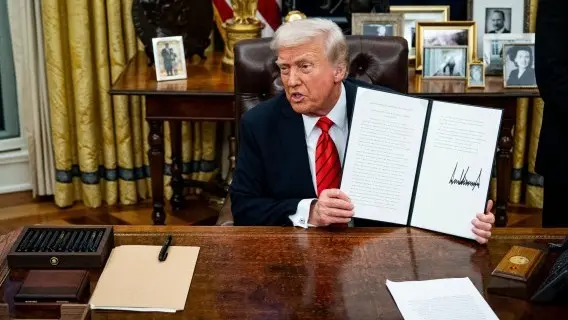 US President Donald Trump displays a signed executive order at the White House on 10 February 2025 of 25% tariffs on steel and aluminium imports