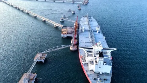 A tanker unloads imported crude oil in Qingdao, Shandong Province, China