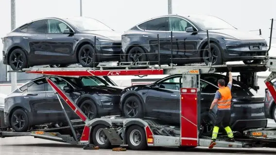 Cars are loaded outside Tesla's German factory in Gruenheide near Berlin