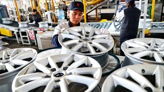Workers at an aluminium factory in Hebei Province, China