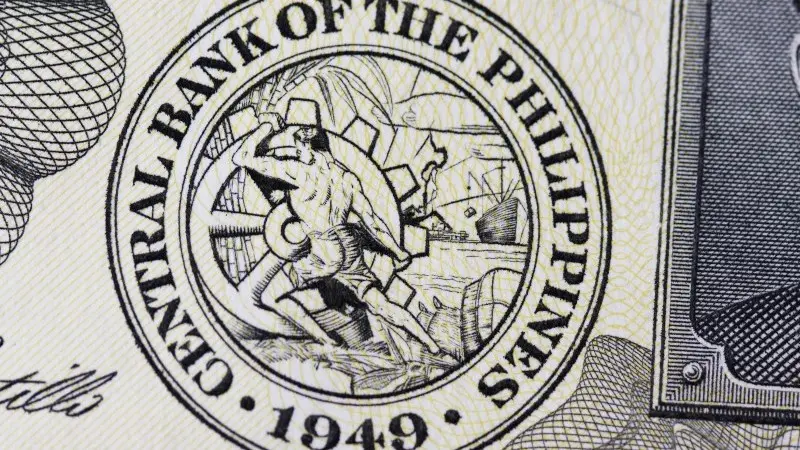 Philippine central bank cuts rates as growth dips to 4-year low