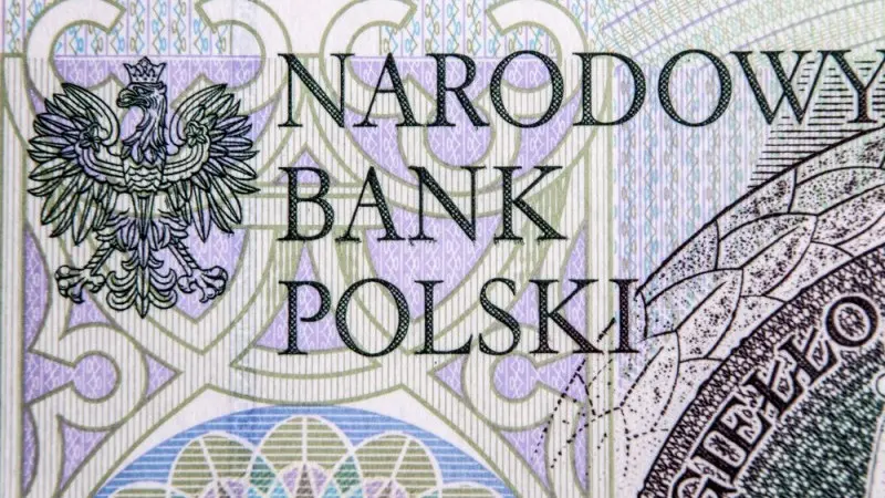 Polish central bank cuts rates close to zero as the zloty appreciates  