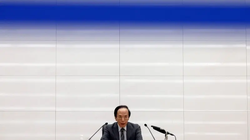 Bank of Japan holds policy rate steady and plans slower tapering